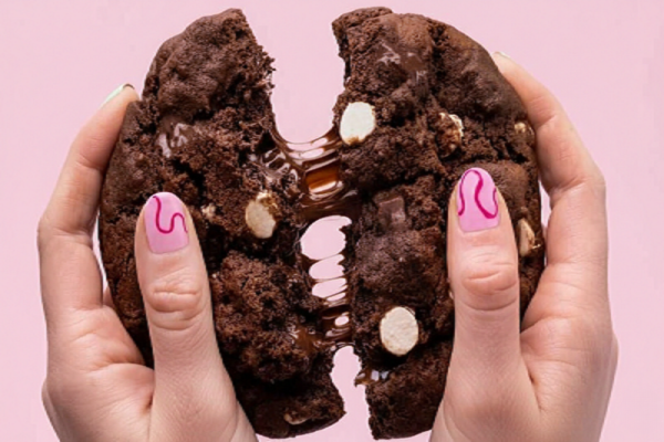 Crumbl mini cookie size comparison in hand